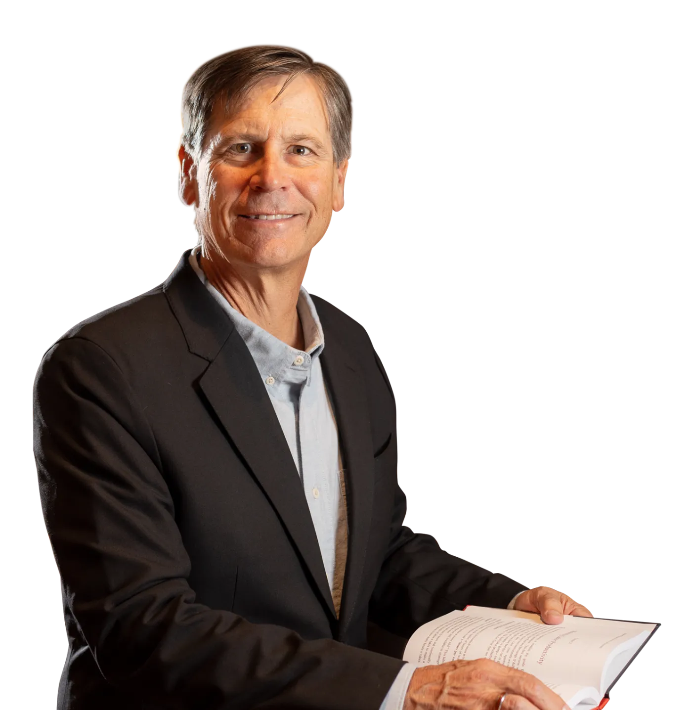 David Lund portrait with open book on lap